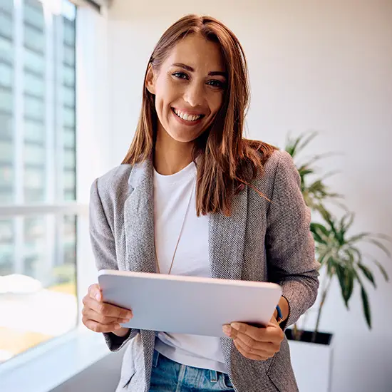 marketer-iStock-1925293271 young marketing executive holding a tablet in her office